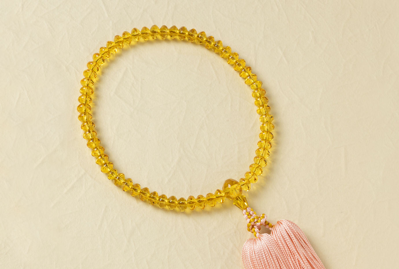 黄水晶5×7ミリ切子単念珠共仕立