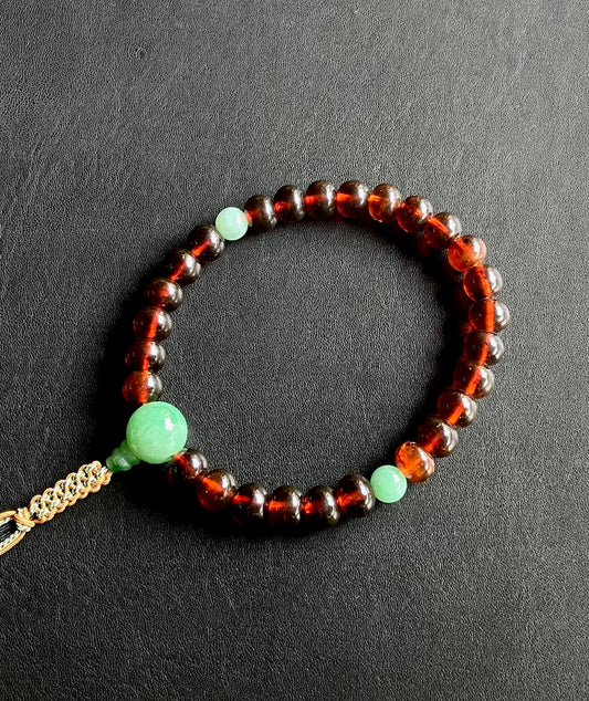 撫順琥珀10ｘ12ﾐﾘみかん玉単念珠緑翡翠仕立