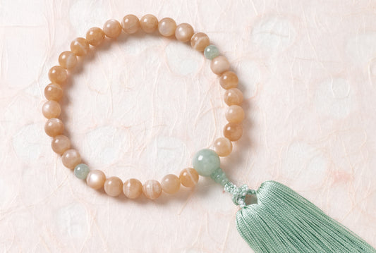 オレンジムーンストーン１０ミリ単念珠翡翠仕立